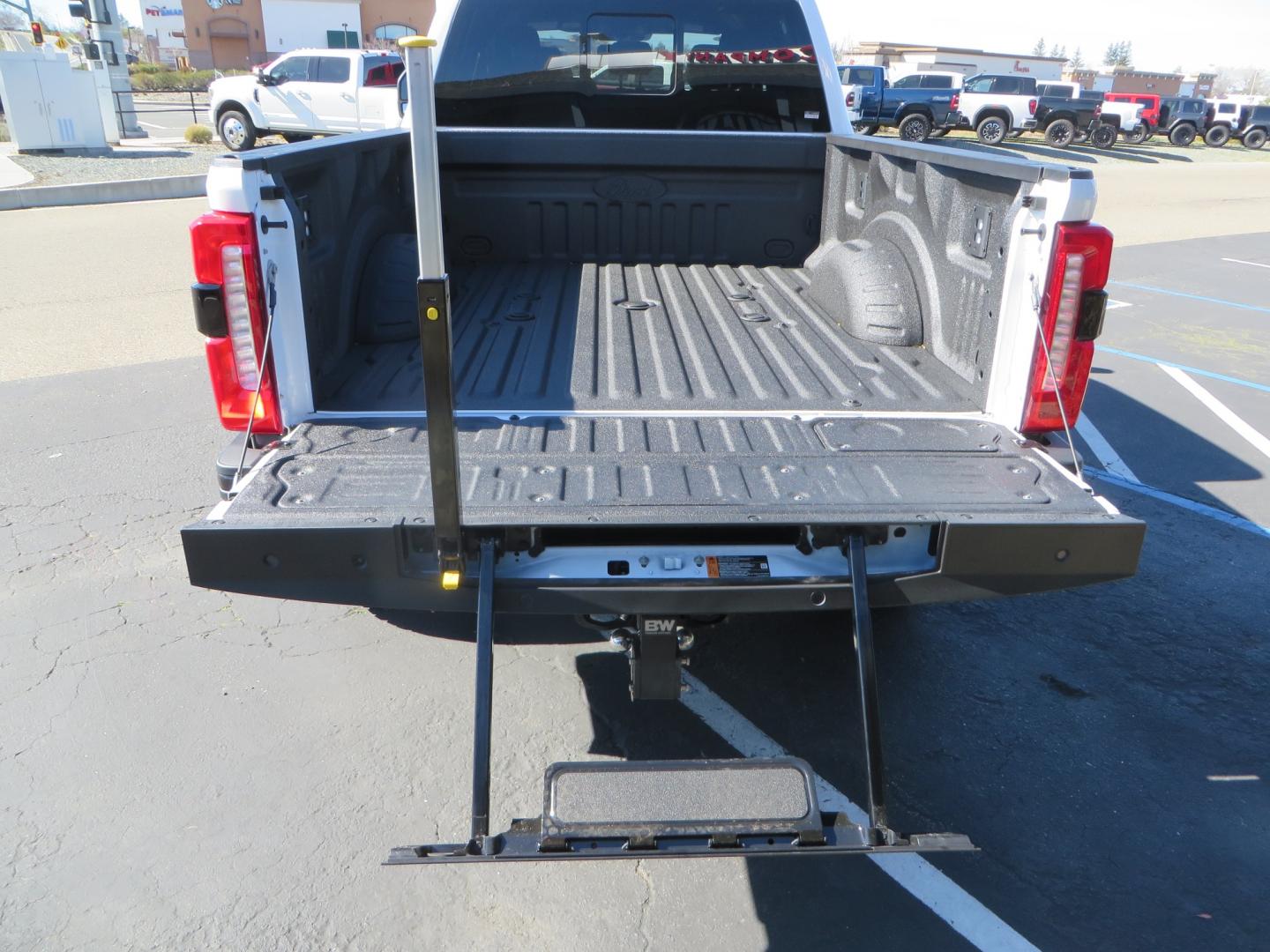 2024 White /BROWN Ford F-250 SD King Ranch Crew Cab 4WD (1FT8W2BM0RE) with an 6.7 HI OUTPUT POWER STROKE engine, 10-SPEED AUTO TORQSHIFT transmission, located at 2630 Grass Valley Highway, Auburn, CA, 95603, (530) 508-5100, 38.937893, -121.095482 - New 24 King Ranch featuring a BDS 3" radius arm suspension system, Fox 2.5 Performance Elite series shocks, Fox ATS steering stabilizer, 37" Nitto Ridge Grappler tires, 18" Method MR315 wheels, 2wd front bumper valance, B&W Tow and Stow hitch, and a Bolt Lock. - Photo#15